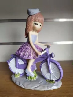 Dekorácia dievčatko na bicykli